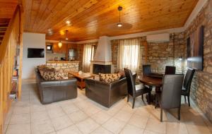 a living room with a couch and a table at ORIZON LIVING Lefkada in Vavkerí