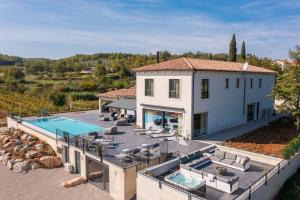 an aerial view of a house with a swimming pool at Villa Cypress Hill in Motovun