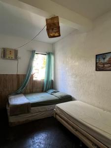 Ένα ή περισσότερα κρεβάτια σε δωμάτιο στο Hostel Rio Surf House +131 φωτογραφίες