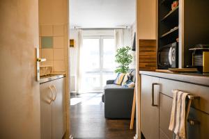 Η κουζίνα ή μικρή κουζίνα στο L'Osmose - Central & Cosy - Accès Tram Strasbourg - Commerces à Proximité