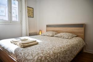 Ένα ή περισσότερα κρεβάτια σε δωμάτιο στο L'Osmose - Central & Cosy - Accès Tram Strasbourg - Commerces à Proximité