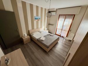 Katil atau katil-katil dalam bilik di Marrana apartment intero appartamento a Tropea