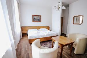 Voodi või voodid majutusasutuse Hotel Šipka toas