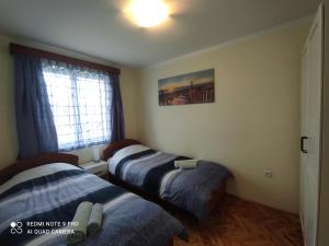 Katil atau katil-katil dalam bilik di Apartman Vito