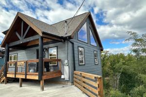 a gray house with a gambrel roof at Hickory Haven By Avada Properties in Gatlinburg