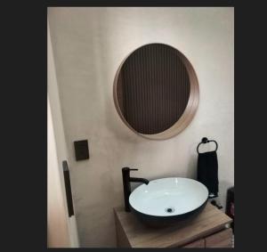 a bathroom with a sink and a mirror on the wall at Loft Chapultepec in Amecameca de Juárez