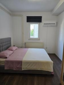 Postel nebo postele na pokoji v ubytování Apartment Knežević 2