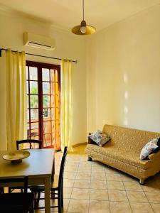 a living room with a couch and a table at Da Liliana Apartment in Mazara del Vallo