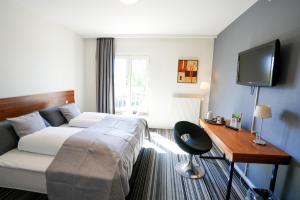 Postel nebo postele na pokoji v ubytování Østergaards Hotel