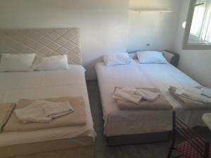 Postel nebo postele na pokoji v ubytování Apartmani Jacimovic