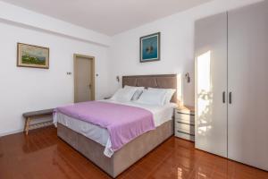 Postel nebo postele na pokoji v ubytování Rooms Ivka