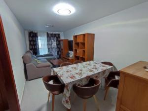 a living room with a table and some chairs at Casa Zenn in Puerto del Rosario