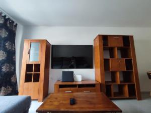 a living room with a tv and a coffee table at Casa Zenn in Puerto del Rosario