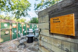 a sign on a wall that reads wash house at 1929 Wash House in Fredericksburg