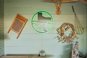 a wall with a mirror and other items on it at 1929 Wash House in Fredericksburg