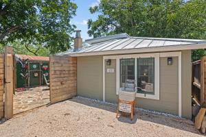 a small shed with a solar roof on it at 1929 Wash House in Fredericksburg +9 photos
