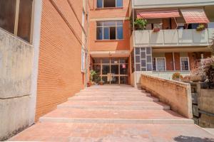 a brick walkway leading to a building at San Giacomo Sweet Home in Nettuno