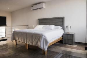 Ένα ή περισσότερα κρεβάτια σε δωμάτιο στο Departamentos Madero +67 φωτογραφίες