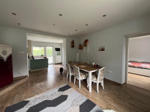 a kitchen and dining room with a table and chairs at Három Piszke Vendégház in Mátraszőlős +27 photos