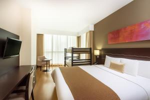 En eller flere senger på et rom på Tryp by Wyndham Panama Centro