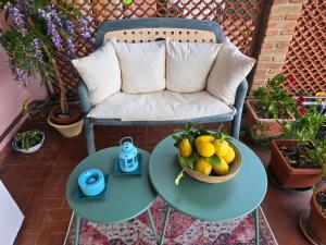 a table with a bowl of fruit on a patio at Casa Anna Maria in Monterosso al Mare