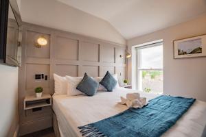 a bedroom with a bed with a blue rug on it at Superb Marina Studio- Sleeps 3 in Dublin