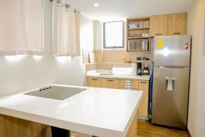 Kuchyň nebo kuchyňský kout v ubytování Apartamento con encanto y diseño + 17 fotografií