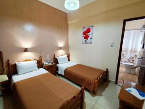 Postel nebo postele na pokoji v ubytování Hotel Anagennisis