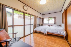 Giường trong phòng chung tại BAMBOO HOUSE YUMOTO - Vacation STAY 89206v +4 ảnh