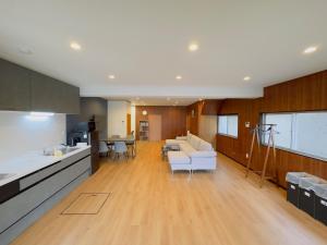 a kitchen and living room with a couch and a table at Midori - House - Vacation STAY 18974 in Midori