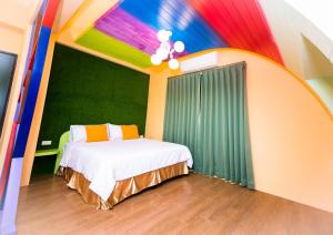Postel nebo postele na pokoji v ubytování Zih Yue Tong Homestay II