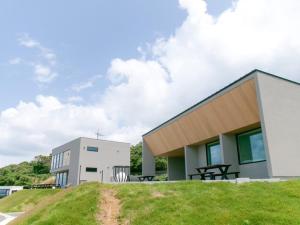 a building with a picnic table in front of it at Villa Mikuri Tsunoshima - Vacation STAY 02206v in Shimonoseki