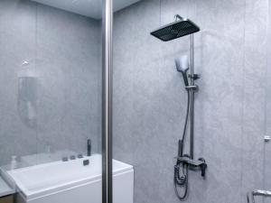 a shower with a glass door next to a toilet at Villa Mikuri Tsunoshima - Vacation STAY 02206v in Shimonoseki