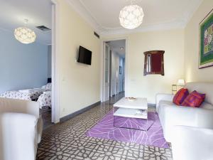 a living room with a couch and a table at Apartment in Barcelona near Passeig de Gràcia in Barcelona