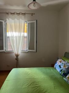 Postel nebo postele na pokoji v ubytování Casa vacanza relax a due passi dal mare