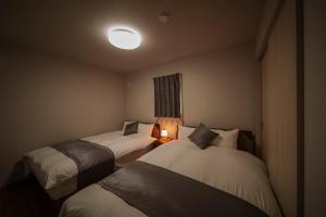 En eller flere senge i et værelse på Mountain Green A "Yuzuki" - Vacation STAY 08283v