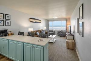 a kitchen and living room with a view of the ocean at Oceanfront Suite - Upper Floor in Lincoln City