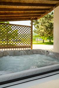 a hot tub under a gazebo at 6 bdrm Cottage at Blue Mountain, Private Beach Access, Hot Tub, Sauna, BBQ, Petfriendly in Blue Mountains