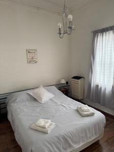 Ένα ή περισσότερα κρεβάτια σε δωμάτιο στο Oasis house Necochea