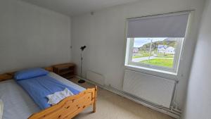 Ένα ή περισσότερα κρεβάτια σε δωμάτιο στο 5-Bedroom Sea View Apartment