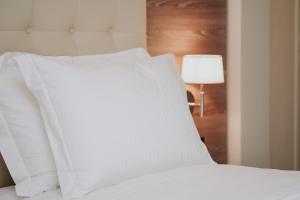 Voodi või voodid majutusasutuse Magnus Hotel toas