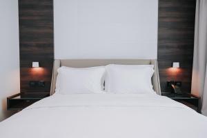 Voodi või voodid majutusasutuse Magnus Hotel toas