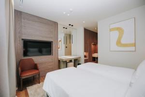 Voodi või voodid majutusasutuse Magnus Hotel toas