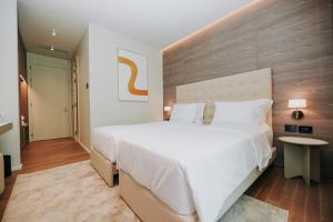 Voodi või voodid majutusasutuse Magnus Hotel toas