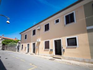 a building on the side of a street at Apartma Flora - Apartment Flora in Koper