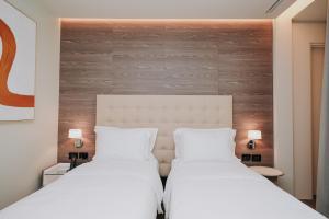 Voodi või voodid majutusasutuse Magnus Hotel toas