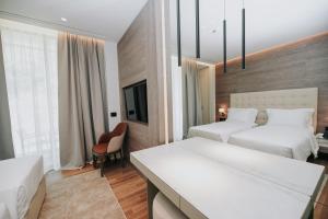 Voodi või voodid majutusasutuse Magnus Hotel toas