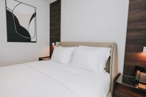 Voodi või voodid majutusasutuse Magnus Hotel toas
