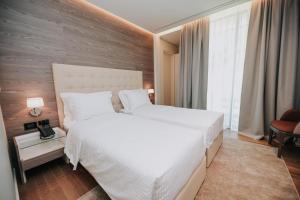 Voodi või voodid majutusasutuse Magnus Hotel toas