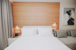 Voodi või voodid majutusasutuse Magnus Hotel toas